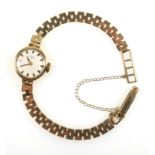 Rotary gold lady's watch on integral gold bracelet strap, gross weight 13 grams.