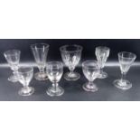 A group of antique drinking glasses, a wrythen moulded short ale glass, on turned over foot, C. 1800