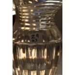 A Georgian cut glass jug with step cut top, dentil edge C. 1820, height 20 cm. Provenance: