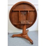 Early Victorian mahogany breakfast table with a tilting circular top, on a tapering octagonal