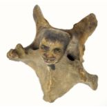 Folk Art ? grotesque carved bone figure with a painted head, and arms upstretched, H 10.7cm, Keswick