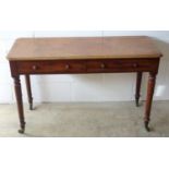 Victorian mahogany writing table with 2 drawers, on turned tapering legs and castors, W 120.5cm