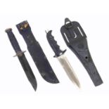 Spartan stainless steel hunting knife with a black hobnail handle, in sheath, and an America