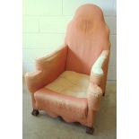 Armchair with an arched back, two stepped scroll arms and shaped apron, on walnut scroll feet, by