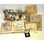 Strand album containing German and other stamps of the world, loose stamps, 5 large cigarette card