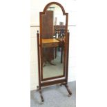 Oak cheval mirror with a bevelled arched plate and fluted decoration, on splayed legs and castors, H