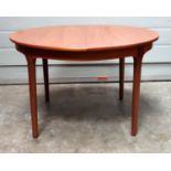 Nathan circular teak dining table with an extending top, on tapering legs, D 121.5cm