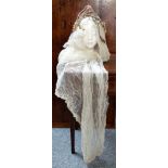 An early 20th century wedding dress and a group of vintage clothes comprising 6 dresses and one