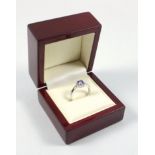 18 ct white gold ring set with a square cut Tanzanite, and sixteen diamonds, ring size O, 2.9