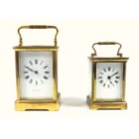 An early 20th century brass carriage clock, the full length enamel dial inscribed Joseph Penlington,