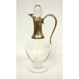 Dartington plain baluster glass claret jug with a silver mounted neck, spout and scroll handle,