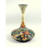 A modern Moorcroft pottery vase of Persian shape, tube lined in colours, dated 2001, impressed