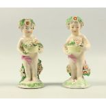 Pair of late 18th century Derby porcelain miniature figures, each modelled holding a basket of