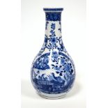 An early 20th century Chinese porcelain onion shaped vase, decorated in underglaze blue with