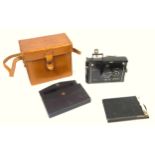 A Plaubel Makina folding camera with accessories, cased