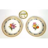 Pair of 19th century Berlin circular porcelain Cabinet plates, each painted with a sprig of mixed