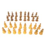 Swiss light and dark carved wood chess set, mostly in the form of figures, of 32 pieces, height of