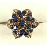 Modern yellow metal sapphire cluster ring, stamped 18K, size G, 5.7grs