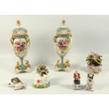 Pair of early 20th century continental porcelain vases and covers, each of ovoid form with
