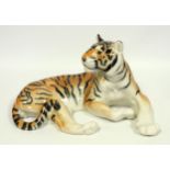 A Lemonosov porcelain model of a recumbent tiger, printed mark