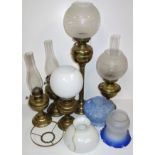 Tall brass oil lamp, H 55.5cm, 2 Duplex lamps, H 29cm and 27cm, 2 other lamps, 3 funnels and 6 glass