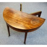 George III inlaid mahogany semi-circular folding top tea table, on tapering legs and castors, W