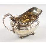 George III silver rounded rectangular milk jug with reeded bands, gadrooned rim and leaf capped