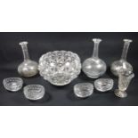 A collection of glassware to include three wheel etched decanters, four boat shaped cut glass salts,