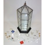 Swarovski cut glass animals, together with 19 similar ornaments and a hexagonal table top three tier