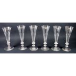 Six late Georgian panelled Champagne flutes
