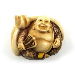 Japanese carved ivory netsuke of a seated man with a fan in his right hand, signed, Meiji period,