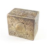 Victorian silver rectangular tea caddy with all-over chased and embossed floral and scroll