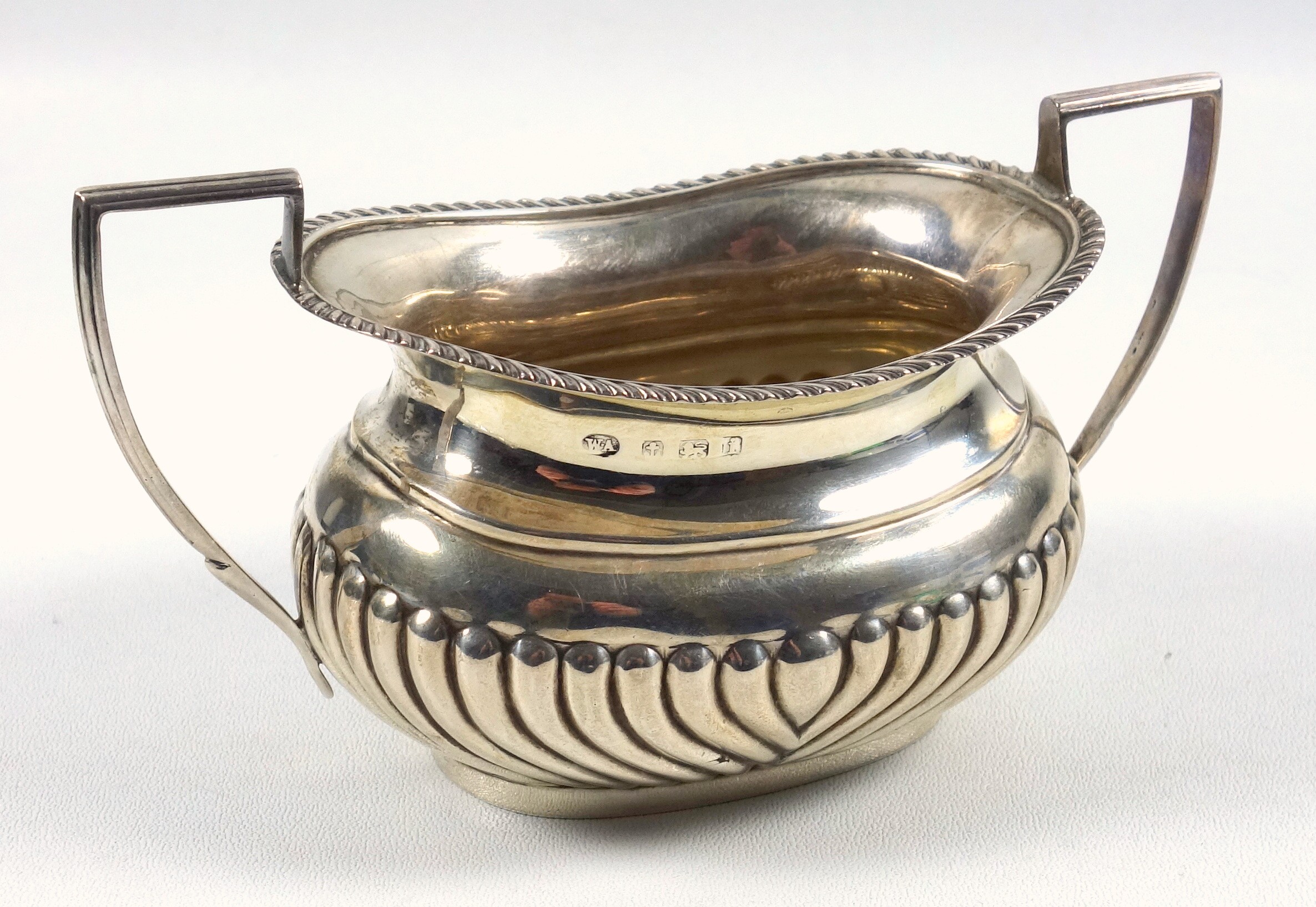 Edwardian silver semi-fluted rounded rectangular sugar basin with a gadrooned rim and 2 bracket