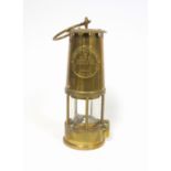 An Eccles type 6 M&Q brass Miners lamp