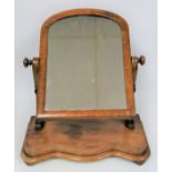 Victorian mahogany finish swing toilet mirror with an arched top, on a serpentine fronted base, H