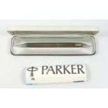 Parker fountain pen with a 14ct gold nib, in a textured white metal case, with a gilt metal clip,