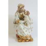 A 19th century Continental porcelain figure of Madonna and Child, each wearing classical robes