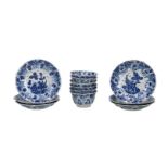 A set of six blue and white porcelain cups and saucers with a decoration of lotus in relief and a