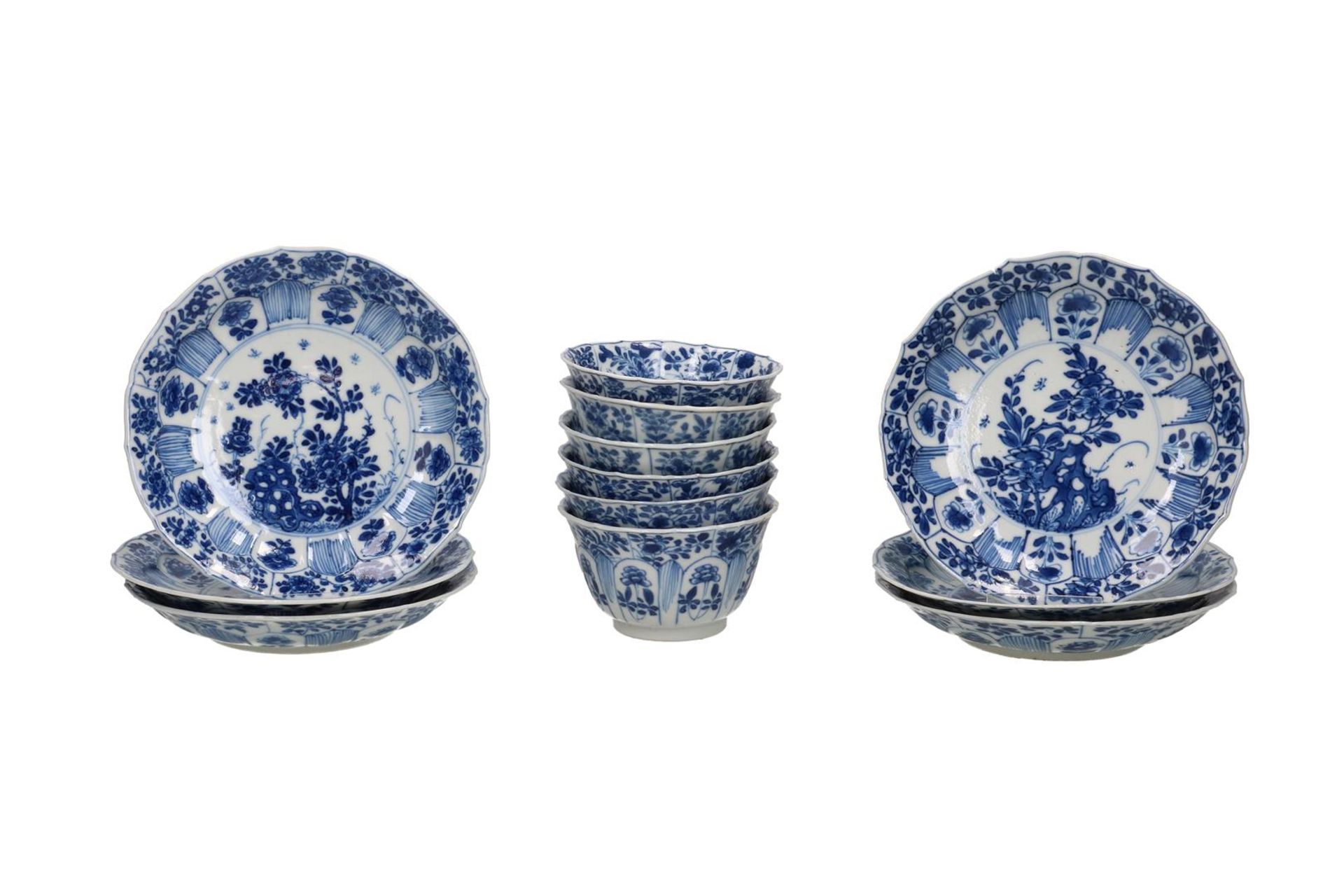 A set of six blue and white porcelain cups and saucers with a decoration of lotus in relief and a