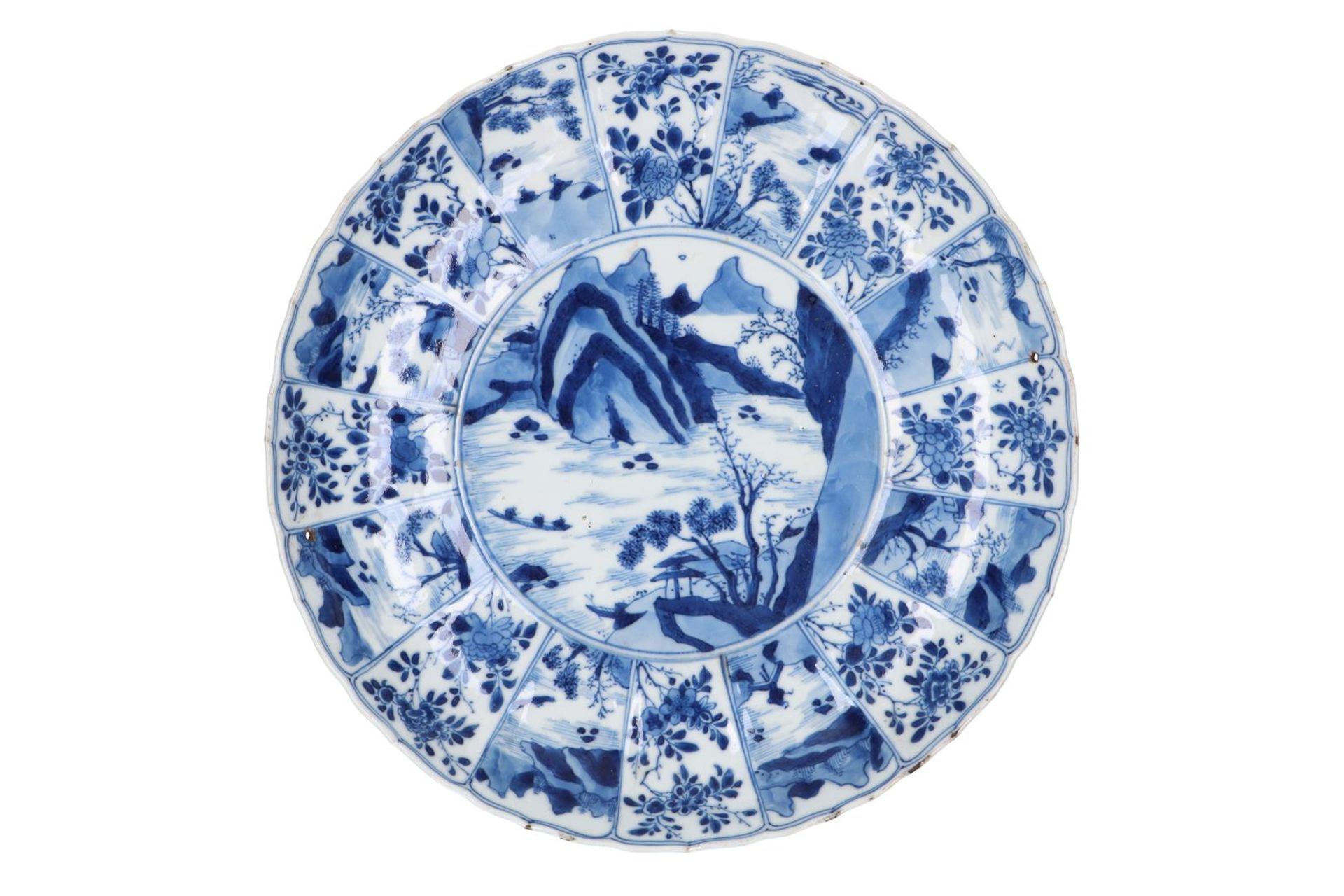 A blue and white porcelain dish with scalloped rim, decorated with ladies in a garden and flowers. - Image 2 of 5