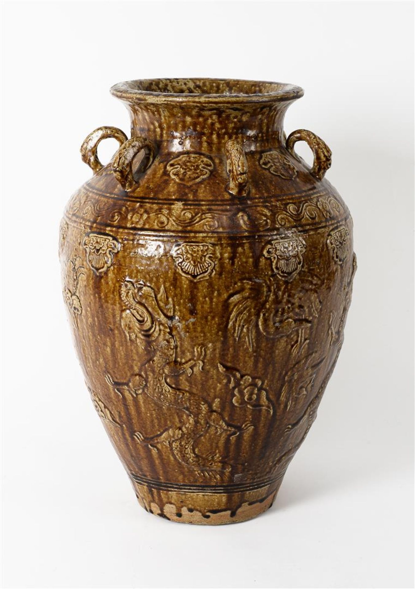 A glazed pottery martaban jar with six rings, decorated in relief with dragons and flowers. - Image 3 of 6