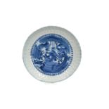 A blue and white 'kraak' porcelain dish with a scalloped rim, decorated with a bird of prey.