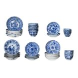 A diverse lot of blue and white porcelain objects, including 18 cups and 25 saucers. Some marked.