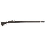 A matchlock musket flat lock with serpentine. Octagonal to round barrel. Stock of blackened wood,