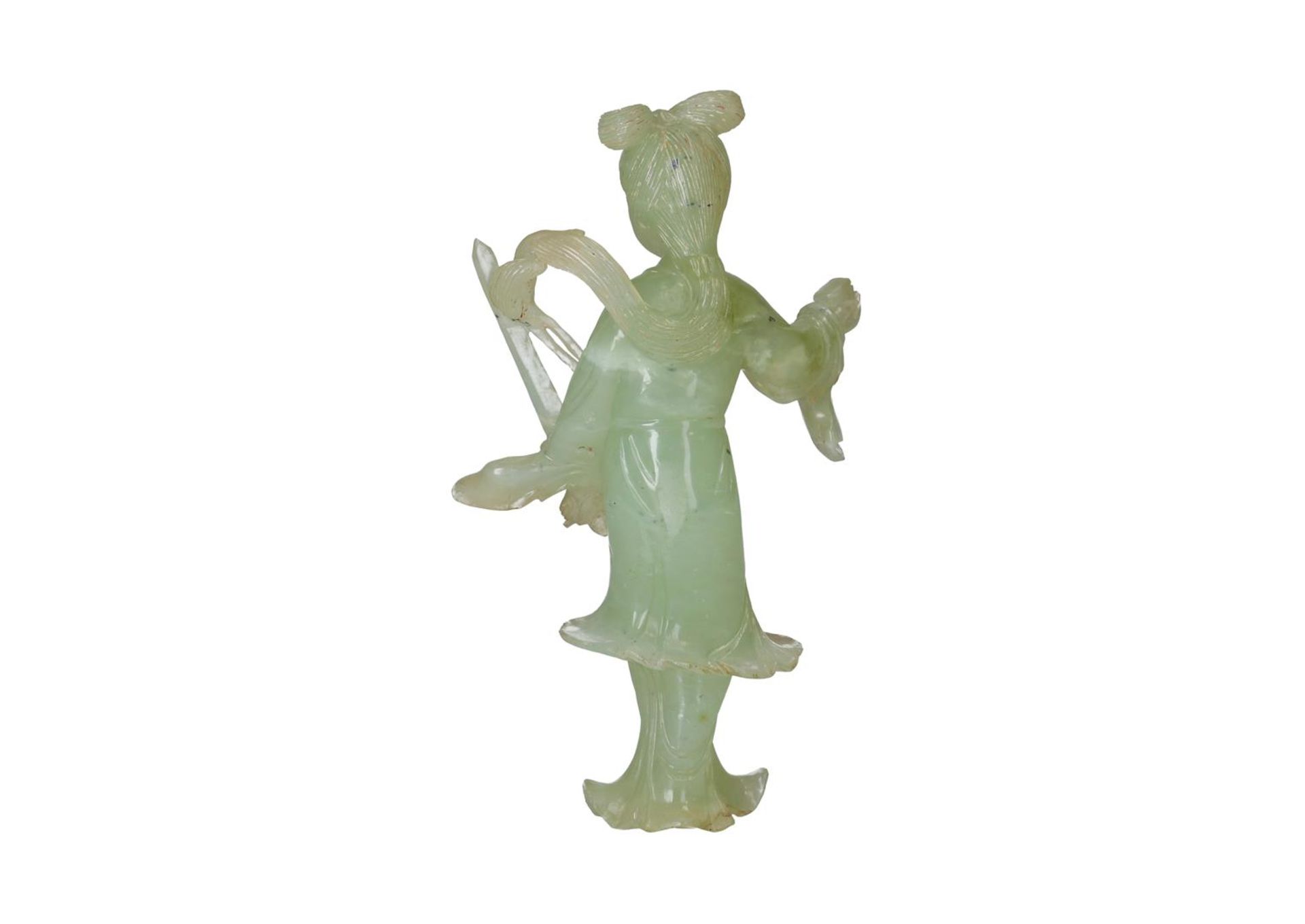 A carved jade sculpture of a woman holding valuables. China, 20th century. H. 15.5 cm. Condition - Image 2 of 4