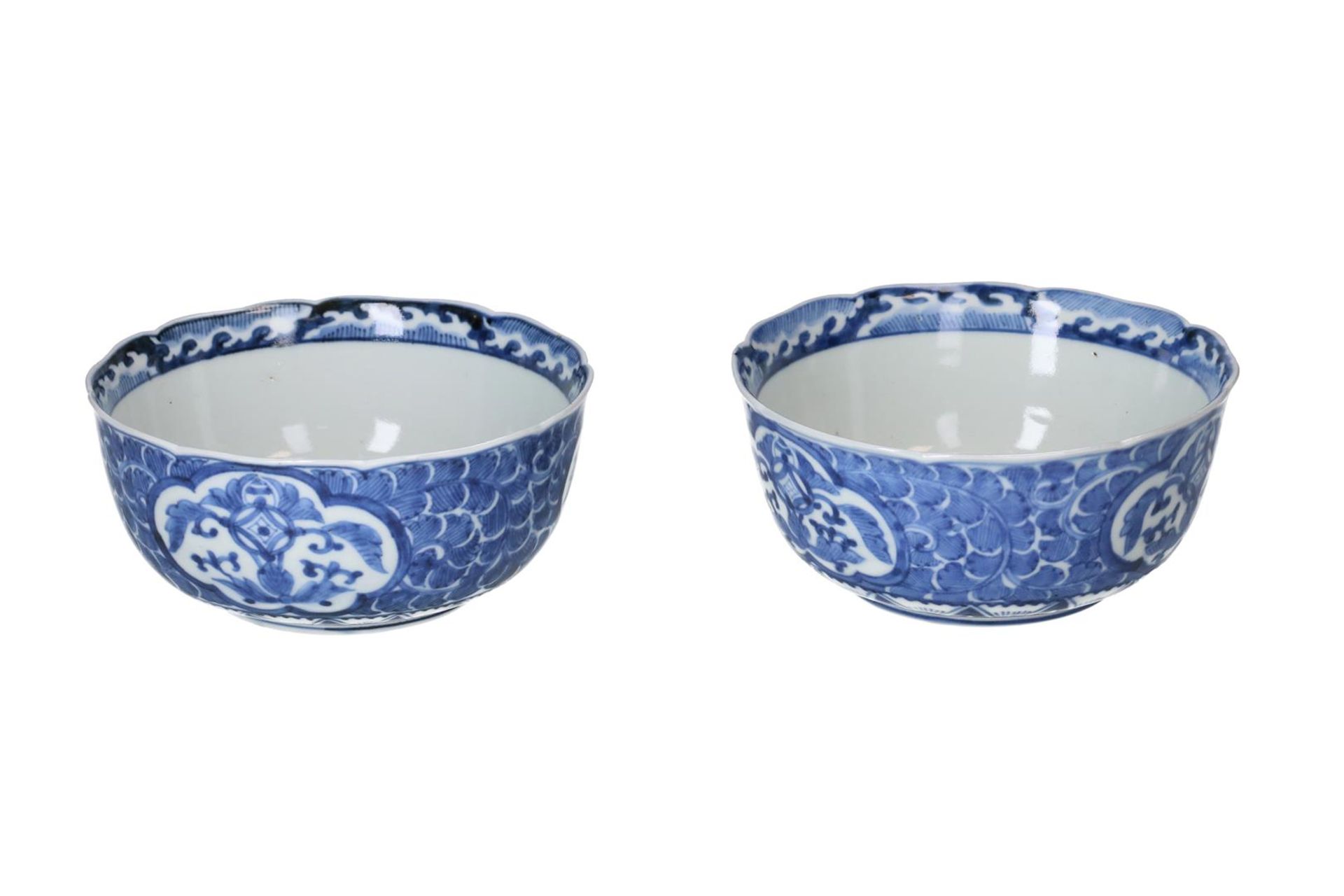 A pair of blue and white porcelain bowls, decorated with flowers. Marked with 4-character mark. - Image 5 of 7