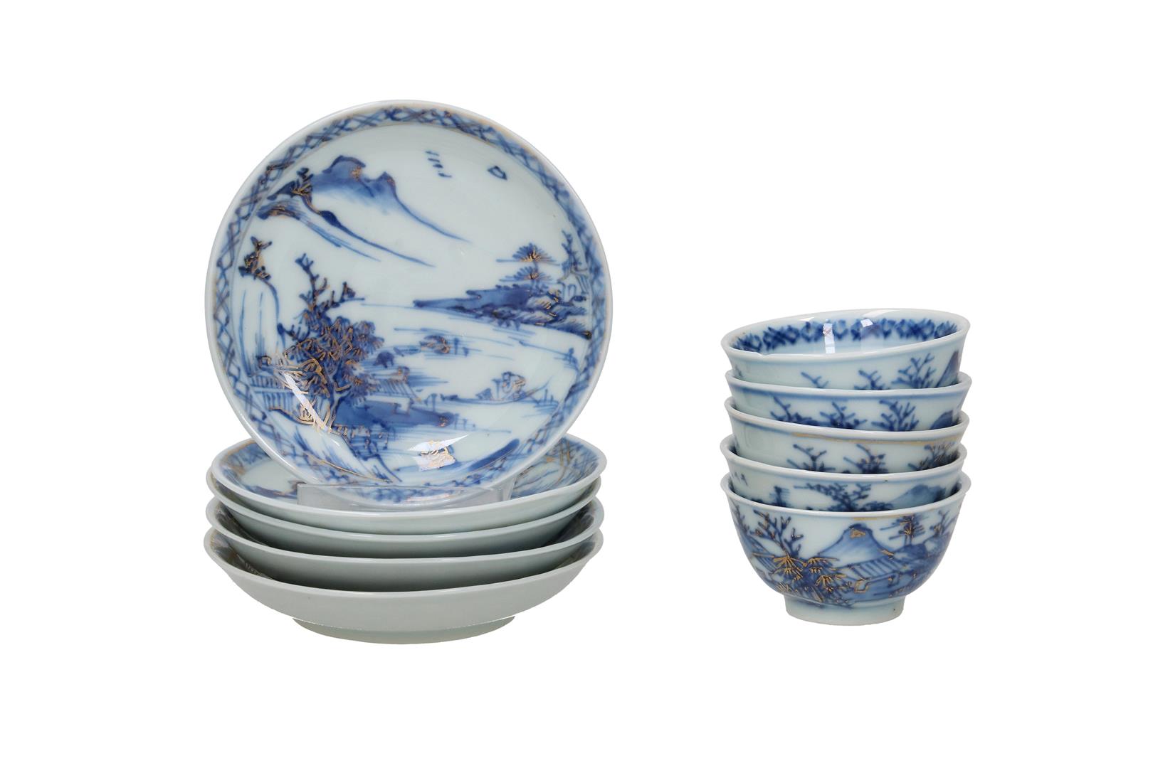 A set of five blue and white miniature porcelain cups and saucers decorated with a landscape decor