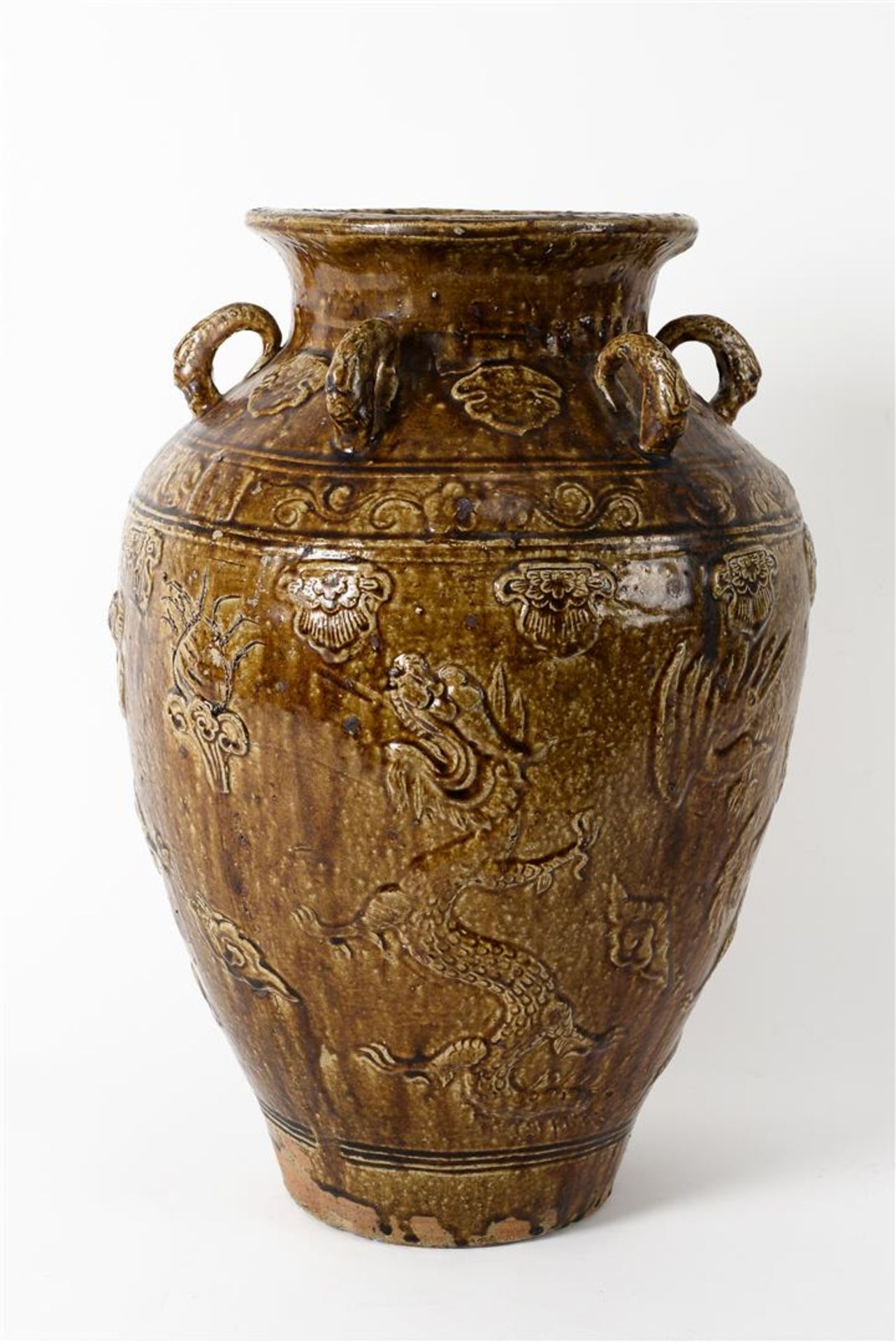 A glazed pottery martaban jar with six rings, decorated in relief with dragons and flowers. - Image 2 of 6