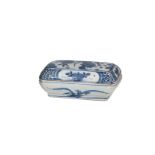 A blue and white 'kraak' porcelain lidded box with two compartments, decorated with flowers.