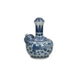 A blue and white porcelain kendi with a geometric decoration of leaves and a phoenix on the belly.